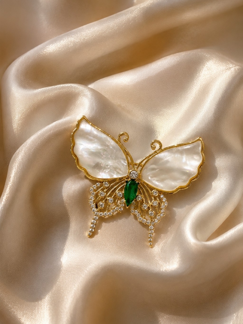 Gold Butterfly Brooch with Mother-of-Pearl Wings and Emerald Accent